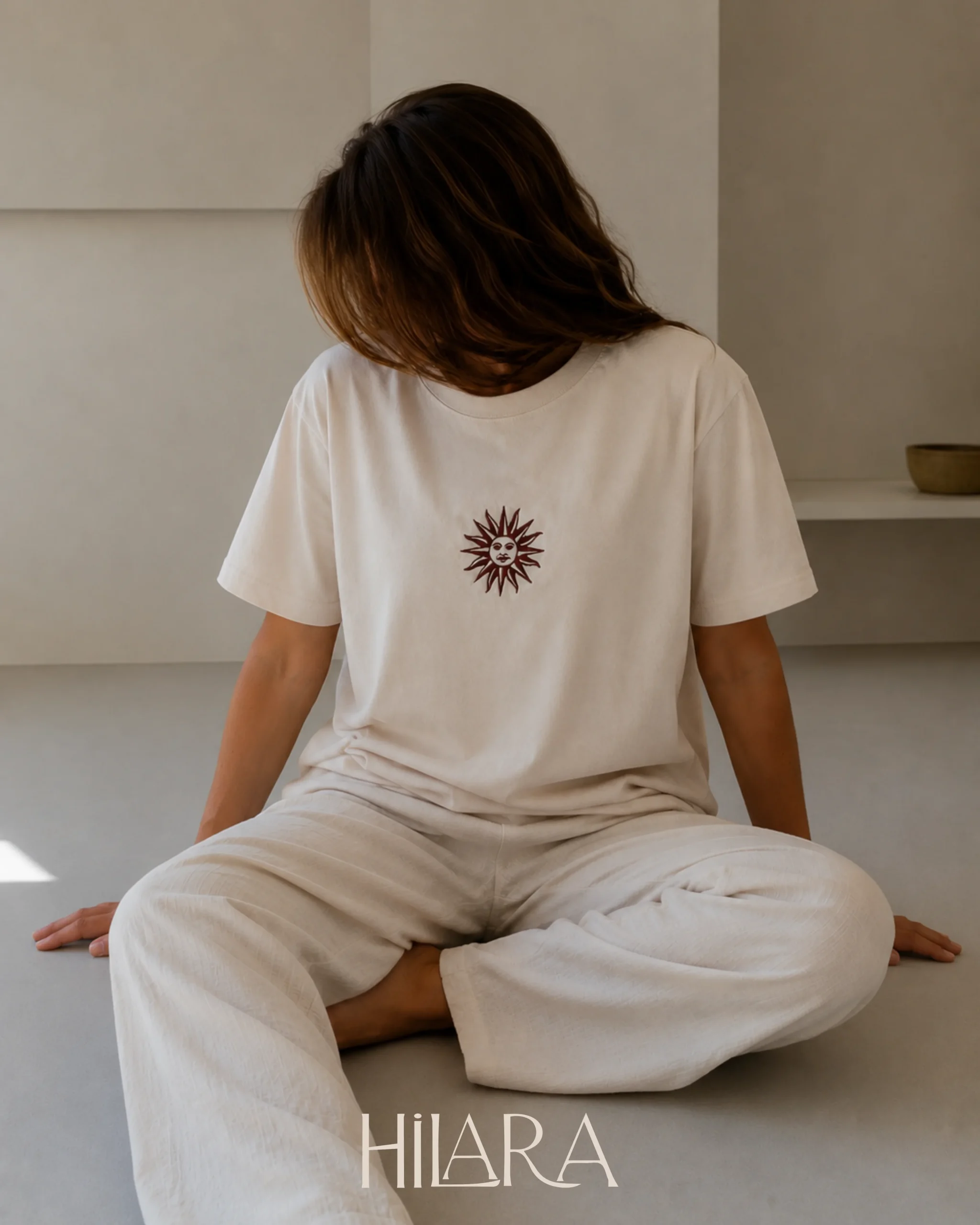 Prenda bordada con Sol de Mayo